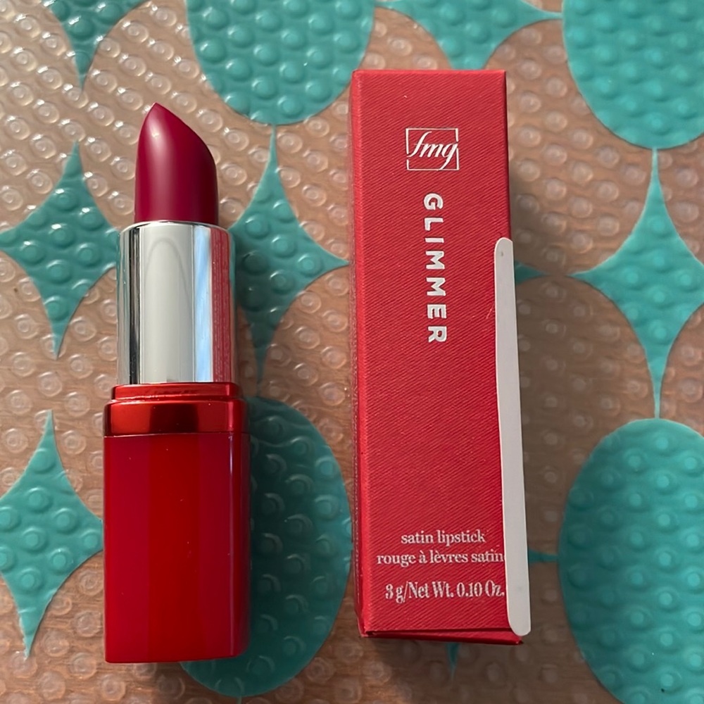 BNIB. fmg Glimmer satin Lipstick in Hibiscus. $10.00